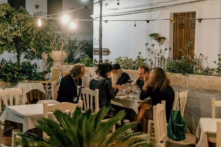 people sitting on chairs inside restaurant